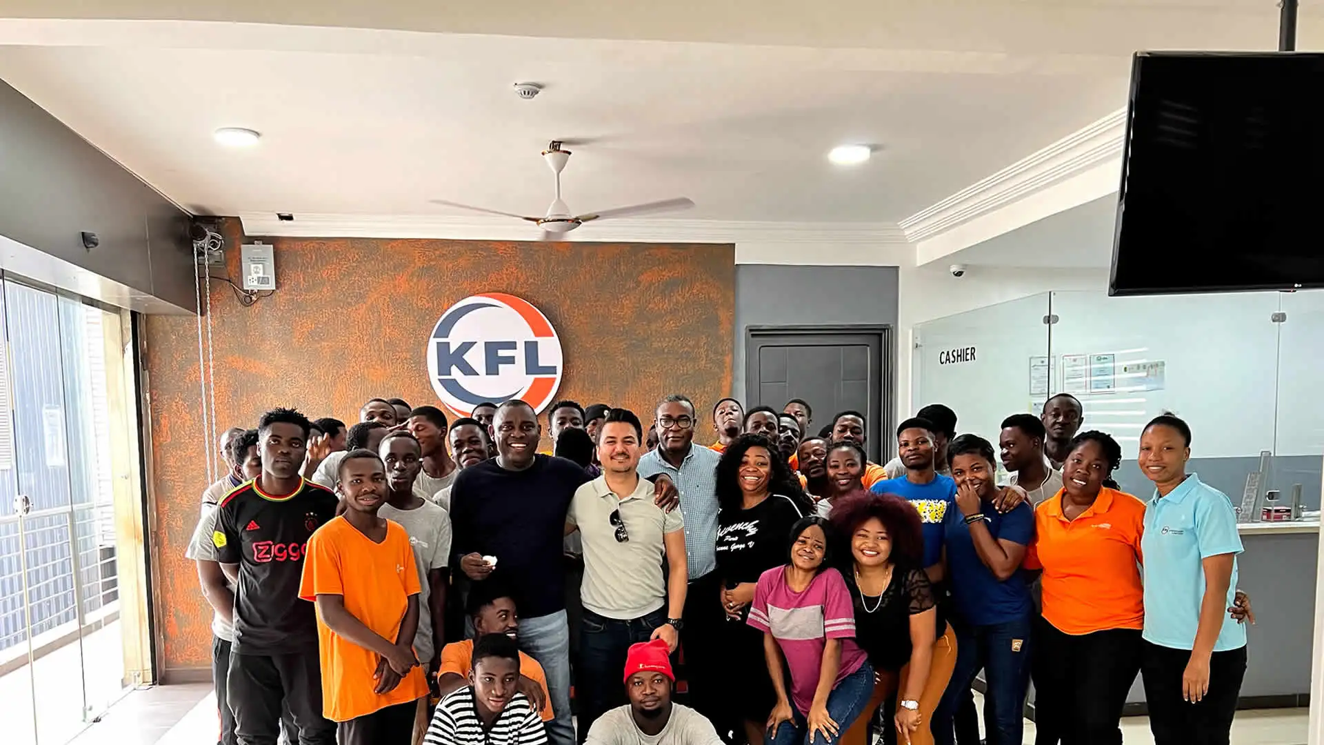 KFL's hardworking staff and workers all smiles in a group picture.